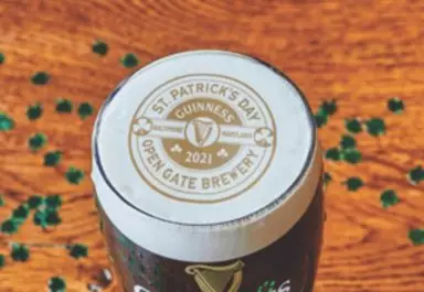 Pint with Ripples print showcasing St Paddy's Day event, surrounded by shamrock glitter
