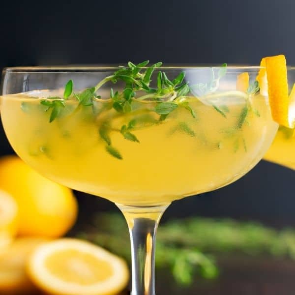 Cocktail garnished with fresh Thyme