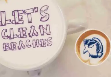 coffee cup saying 'let's clean beaches' in ripples print