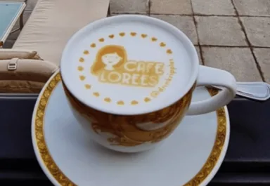 Cafe Lorees latte topped with custom logo design