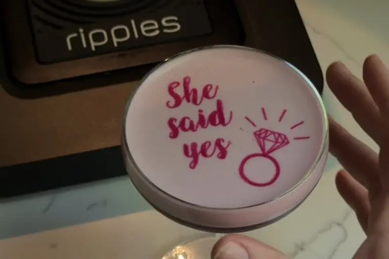 Pink cocktail printed with "She says yes" next to a Ripples cocktail printer